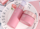 Botella cosmética de lujo y tarro poner crema 10ml - 150ml de la bomba del rosa del ODM del OEM